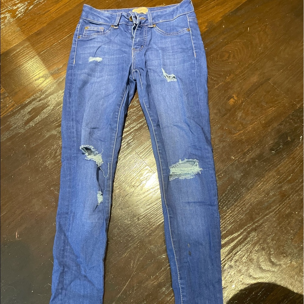 Celebrity pink ripped blue jeans
